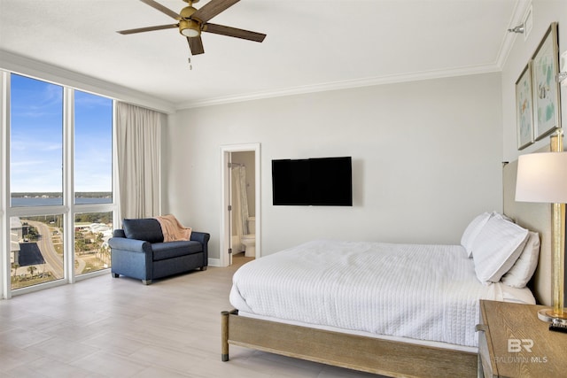 825 W Beach Blvd Unit 10, Gulf Shores, AL 36542 - bedroom featuring floor to ceiling windows, crown molding, baseboards, and ceiling fan