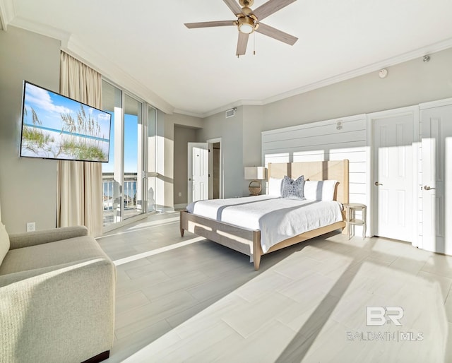 825 W Beach Blvd Unit 10, Gulf Shores, AL 36542 - bedroom with visible vents, ornamental molding, and ceiling fan