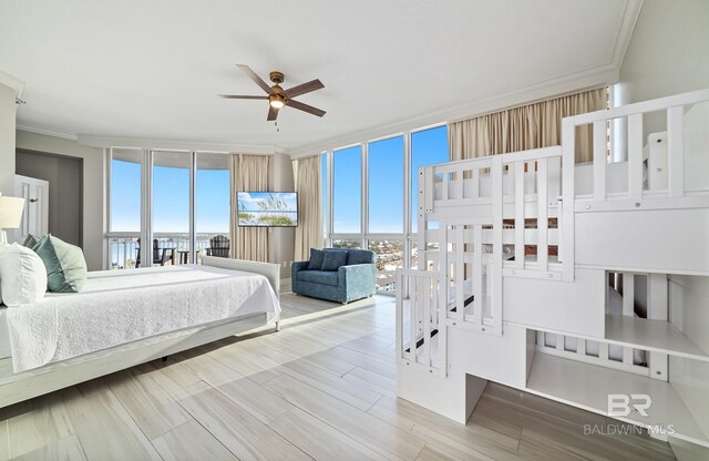 825 W Beach Blvd Unit 10, Gulf Shores, AL 36542 - bedroom with multiple windows, a wall of windows, and crown molding