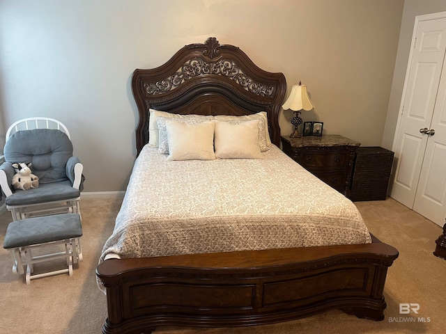 bedroom featuring light colored carpet