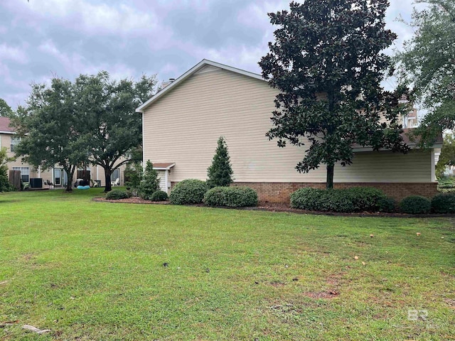 view of property exterior with a yard