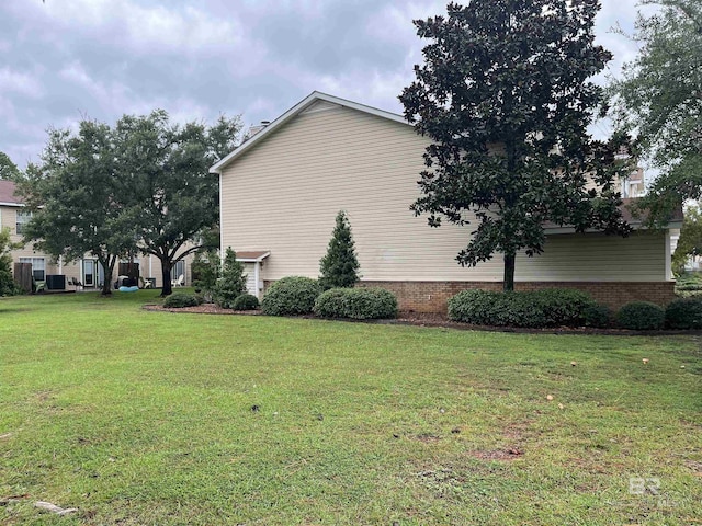 1517 Regency Rd Unit 161, Gulf Shores, AL 36542 - view of property exterior featuring a yard