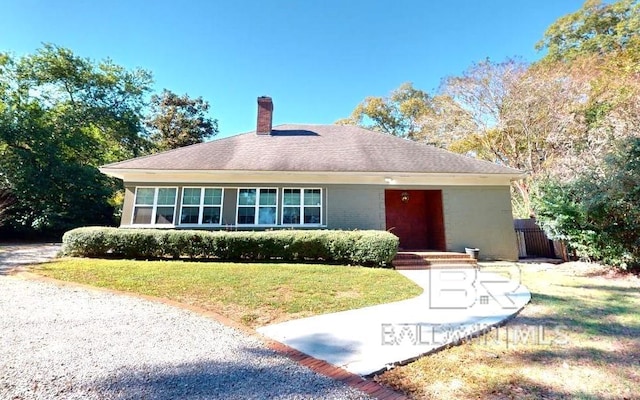 ranch-style house with a front lawn