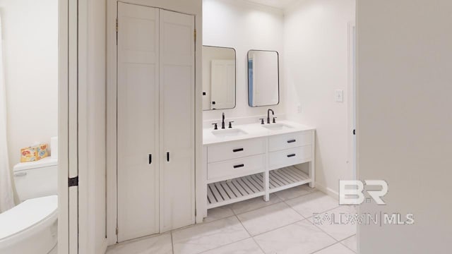 bathroom with vanity and toilet