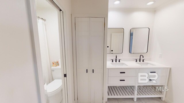 bathroom with vanity and toilet