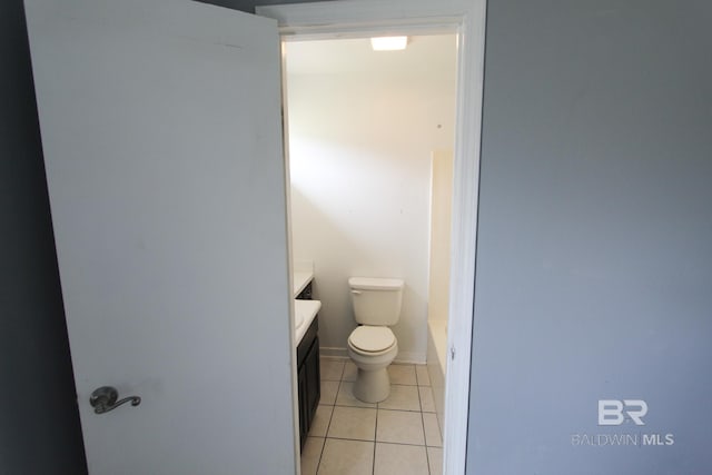 bathroom featuring tile patterned floors, toilet, and vanity