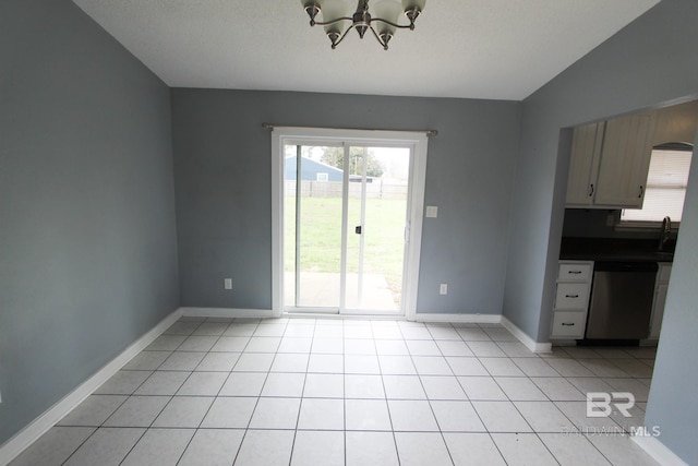 unfurnished dining area with a textured ceiling, lofted ceiling, a chandelier, and light tile patterned floors