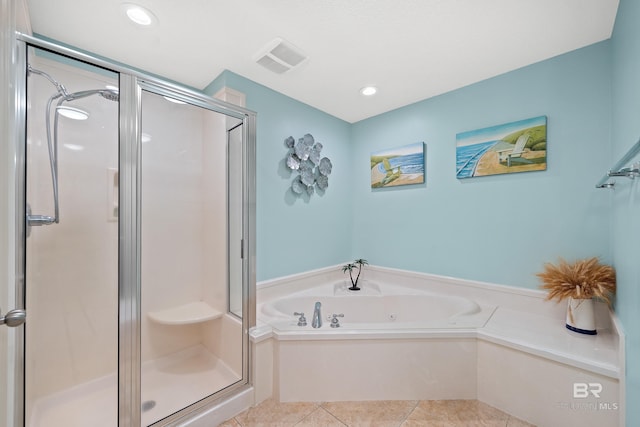 bathroom with separate shower and tub and tile patterned floors