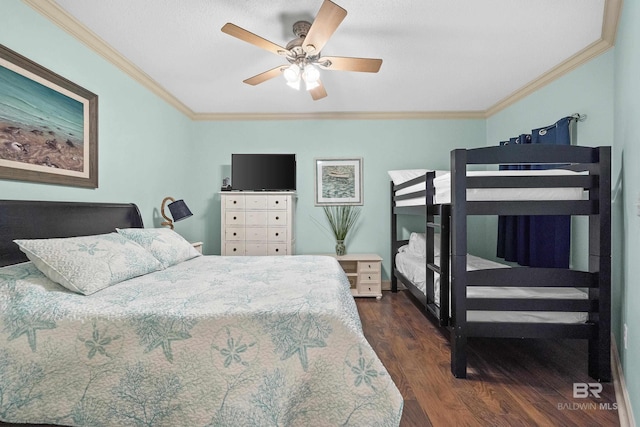 bedroom with ceiling fan, dark hardwood / wood-style floors, and ornamental molding