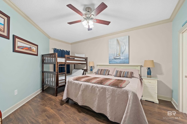 bedroom featuring ceiling fan, crown molding, dark wood-type flooring, and a textured ceiling