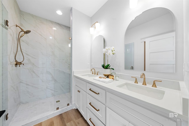 25995 W Perdido Ave, Orange Beach, AL 36561 - full bath featuring a marble finish shower, double vanity, wood finished floors, and recessed lighting