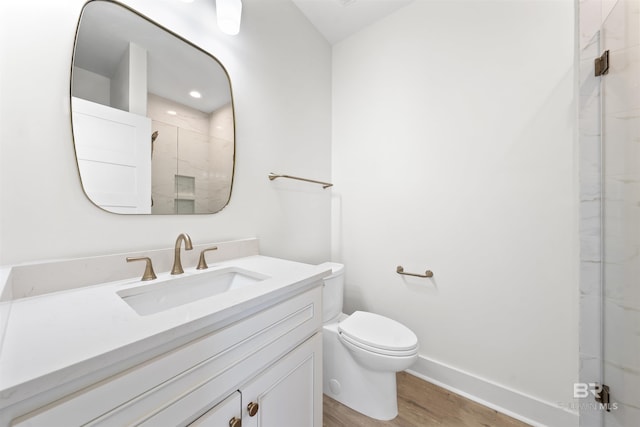 25995 W Perdido Ave, Orange Beach, AL 36561 - bathroom featuring wood finished floors, vanity, and a marble finish shower