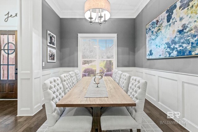 dining room featuring ornamental molding, an inviting chandelier, and dark wood-type flooring