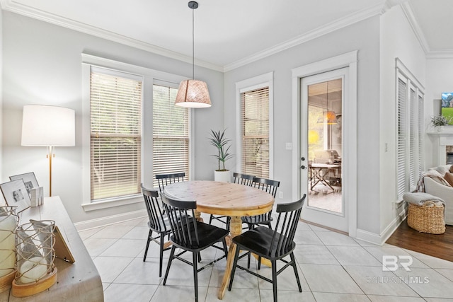 tiled dining area with a wealth of natural light and crown molding