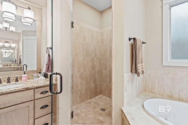 bathroom featuring vanity and plus walk in shower