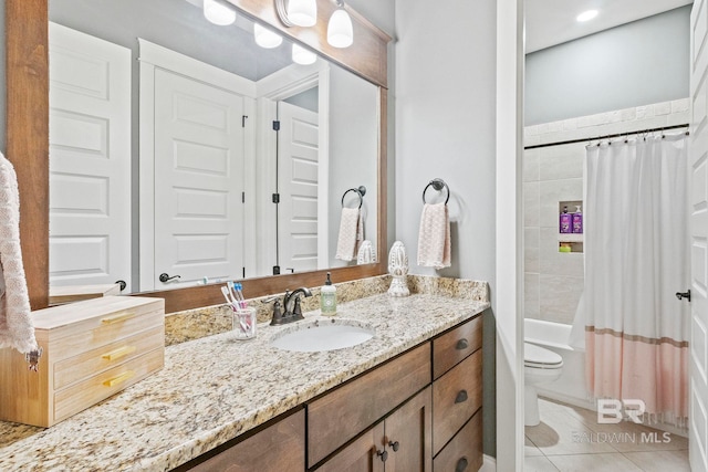 full bathroom featuring tile patterned floors, vanity, toilet, and shower / tub combo