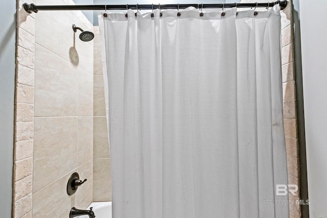 bathroom with shower / bathtub combination with curtain