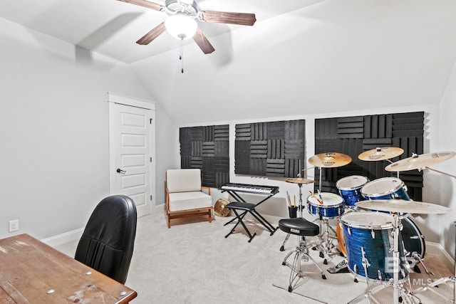 carpeted home office with ceiling fan and lofted ceiling