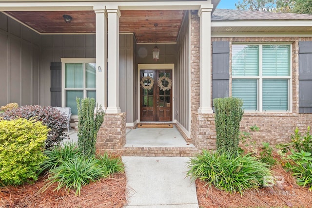 doorway to property featuring covered porch