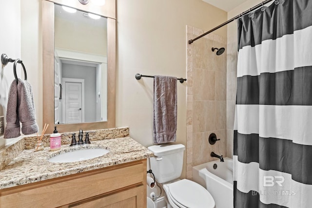 full bathroom featuring shower / tub combo, vanity, and toilet