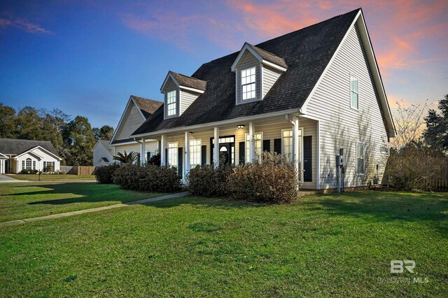9678 Nottingham Ct, Daphne, AL 36526 - new england style home featuring a front lawn and covered porch