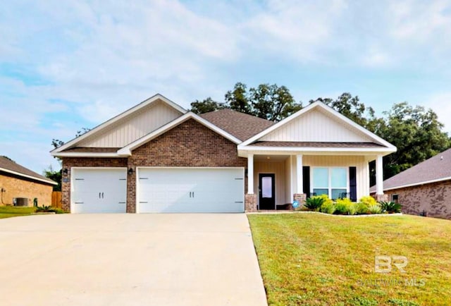 craftsman-style home featuring a garage, a porch, and a front lawn