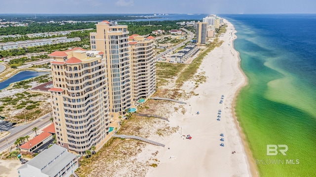 bird's eye view featuring a view of the beach and a water view