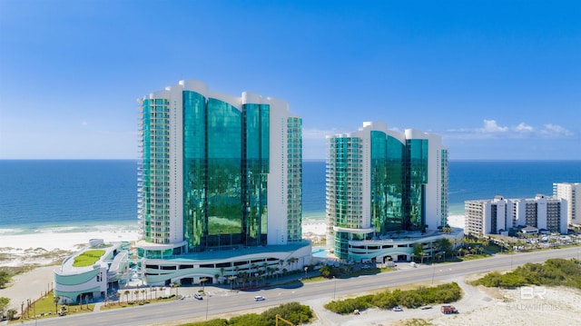 drone / aerial view featuring a water view and a city view