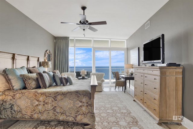 bedroom featuring access to outside, visible vents, floor to ceiling windows, and a ceiling fan