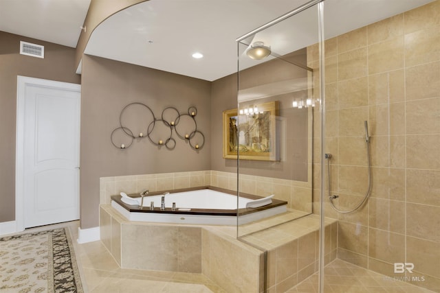 bathroom featuring a bath, a shower stall, visible vents, and tile patterned floors