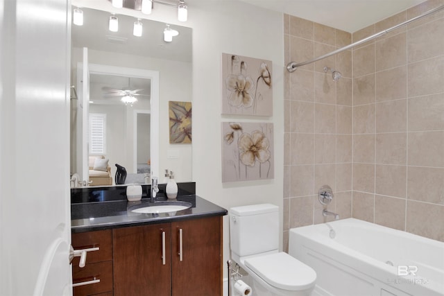 ensuite bathroom featuring ceiling fan, ensuite bathroom, shower / tub combination, toilet, and vanity