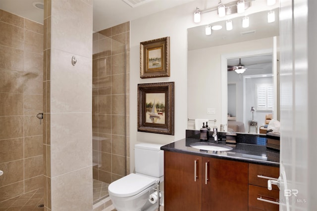 ensuite bathroom featuring visible vents, toilet, ensuite bathroom, a shower stall, and vanity