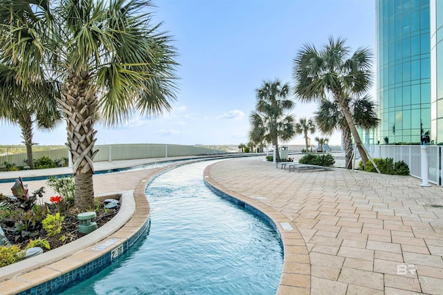 community pool featuring fence