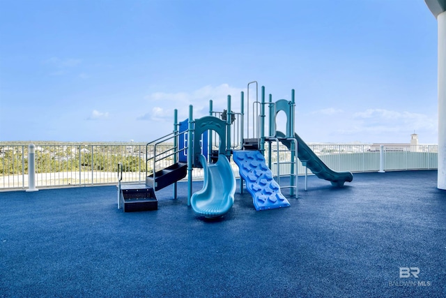 communal playground featuring fence