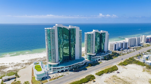 birds eye view of property with a view of city, a water view, and a view of the beach