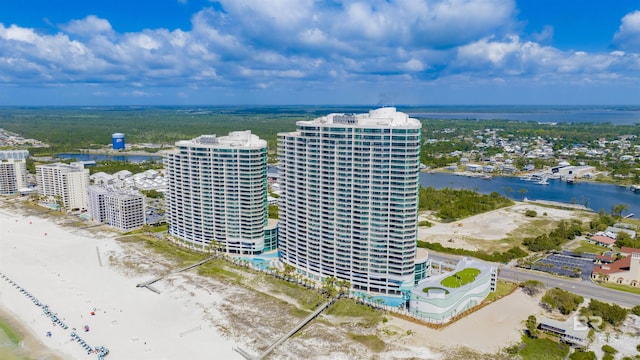 birds eye view of property with a view of city and a water view