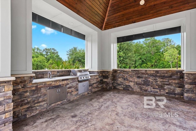 view of patio featuring grilling area, area for grilling, and a sink