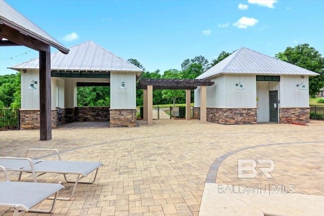 view of patio with a gazebo, a pergola, and fence