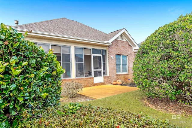 back of property with a patio area