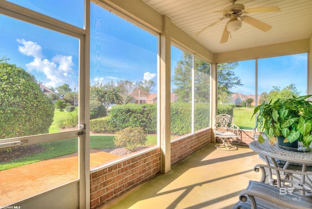 sunroom featuring ceiling fan