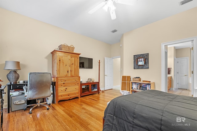 bedroom featuring ensuite bath, ceiling fan, and light hardwood / wood-style floors