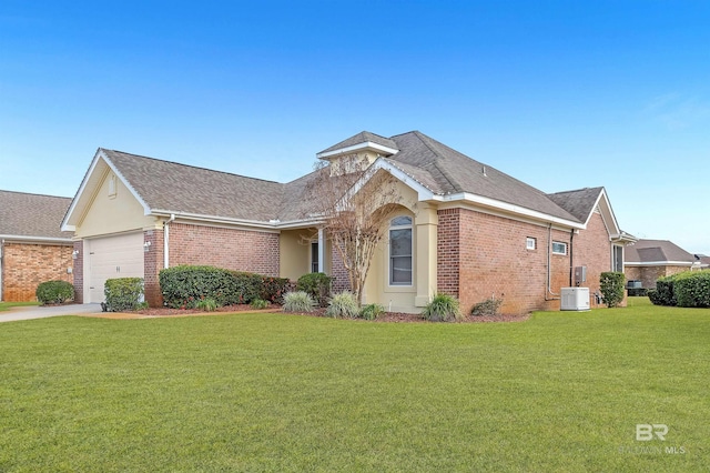 ranch-style house featuring a front yard and a garage