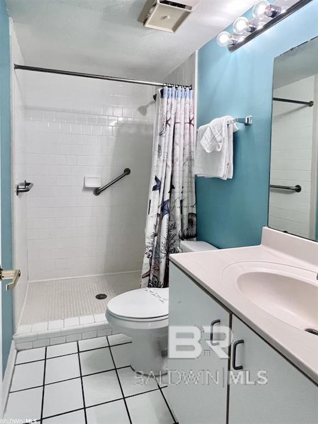 bathroom with toilet, tile patterned flooring, vanity, and a shower with shower curtain