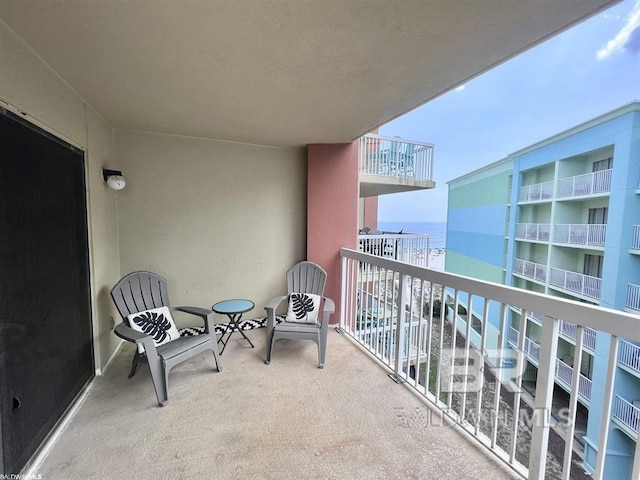 balcony featuring a water view