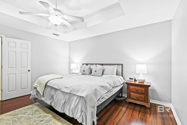 bedroom with ceiling fan and dark wood-type flooring