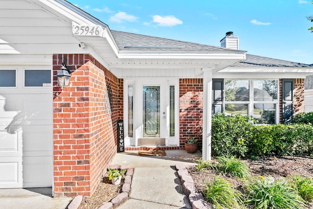 entrance to property featuring a garage