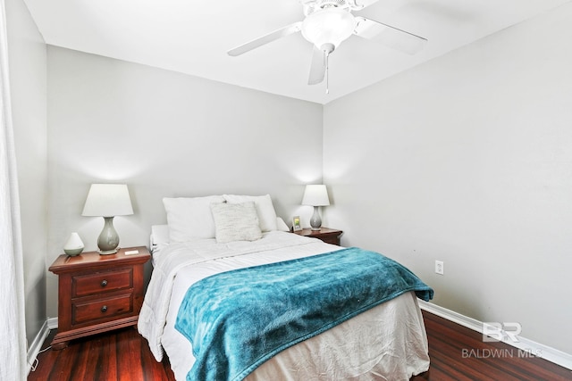 bedroom with ceiling fan and dark wood-type flooring