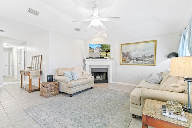 tiled living room featuring vaulted ceiling and ceiling fan