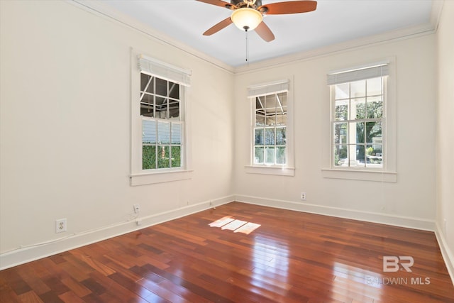 unfurnished room with a wealth of natural light, crown molding, ceiling fan, and wood-type flooring