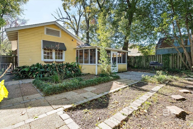 exterior space featuring a sunroom